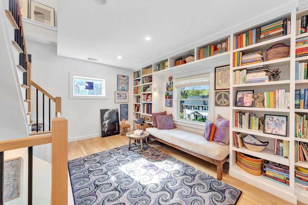 40 Holland Road Melrose, MA 02176 - Photo 19 of 42 a living room with furniture and a book shelf
