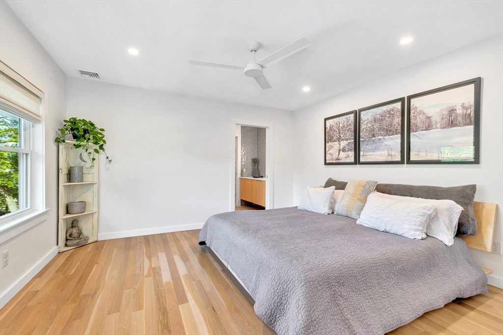 40 Holland Road Melrose, MA 02176 - Photo 20 of 42 a bedroom with a large bed and a window