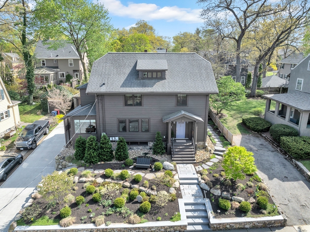 40 Holland Road Melrose, MA 02176 - Photo 2 of 42 an aerial view of a house with a yard and potted plants