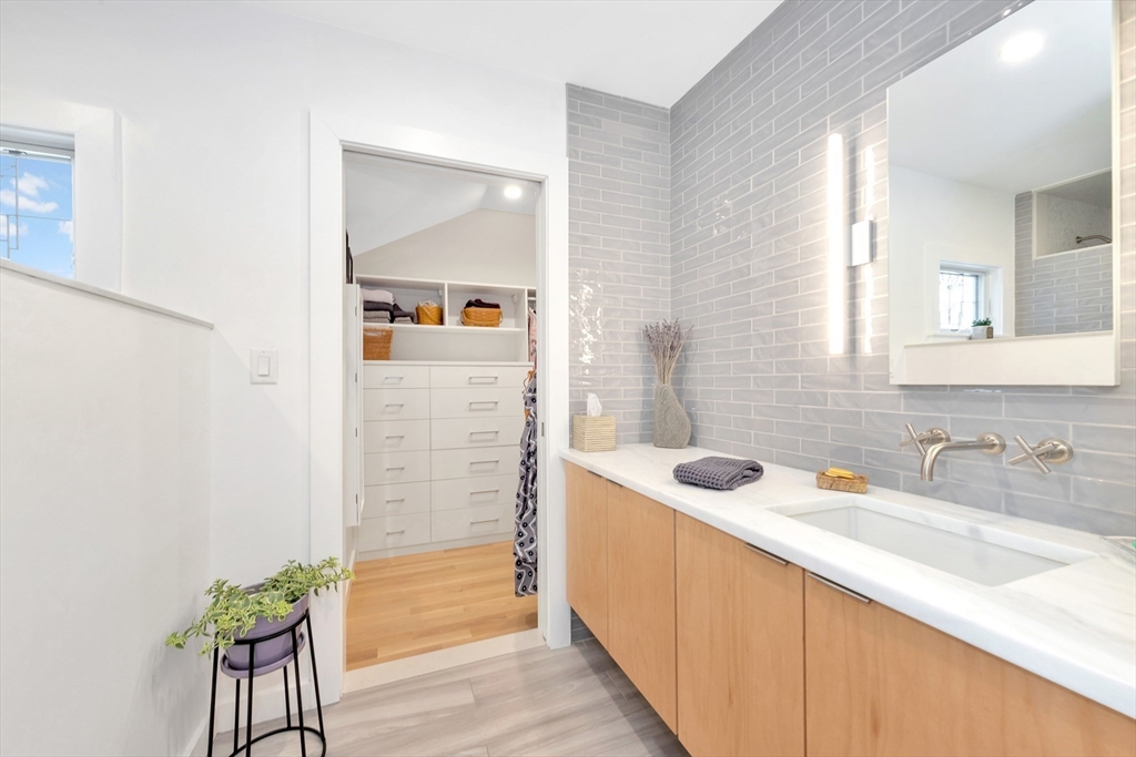40 Holland Road Melrose, MA 02176 - Photo 21 of 42 a bathroom with a granite countertop sink and a mirror