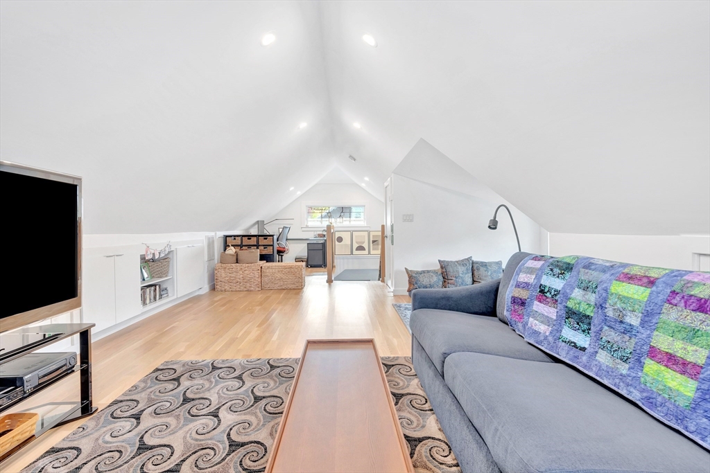 40 Holland Road Melrose, MA 02176 - Photo 28 of 42 a living room with furniture and a flat screen tv