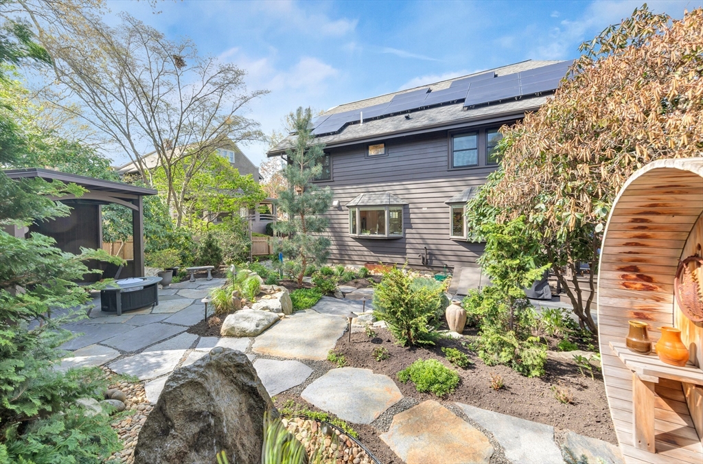 40 Holland Road Melrose, MA 02176 - Photo 31 of 42 a view of a patio with couches table and chairs and potted plants