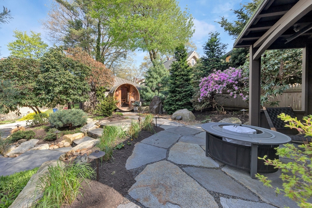 40 Holland Road Melrose, MA 02176 - Photo 39 of 42 a view of a patio with couches table and chairs and potted plants