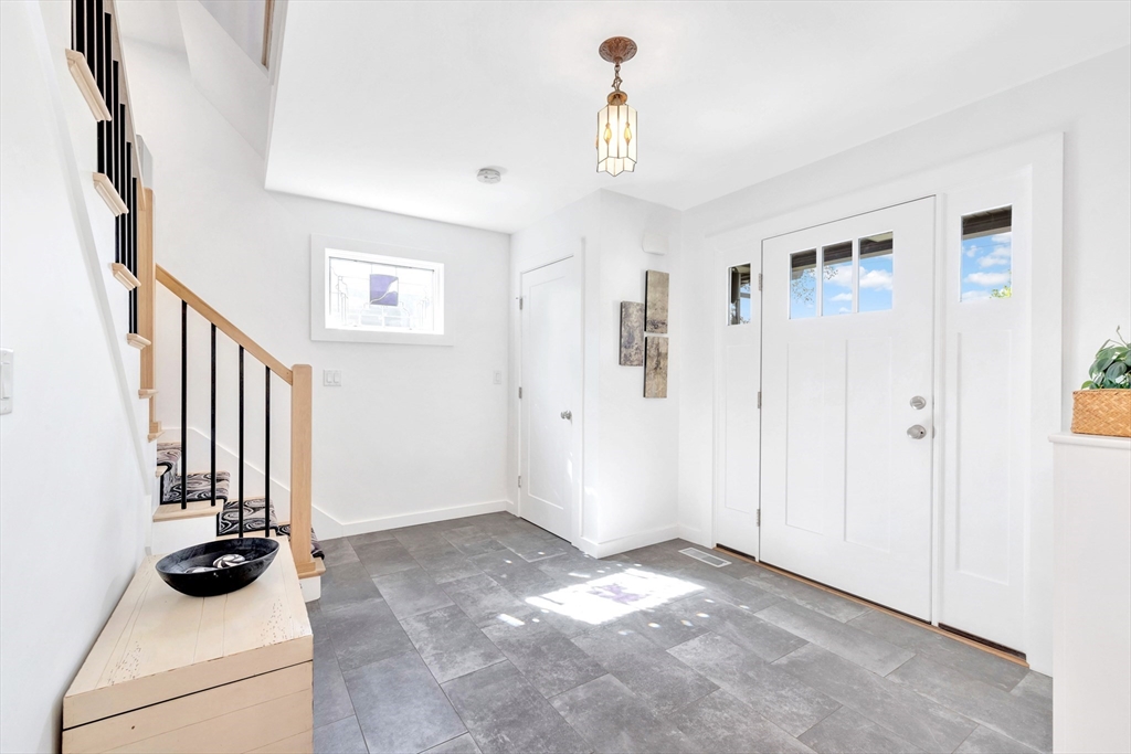 40 Holland Road Melrose, MA 02176 - Photo 4 of 42 a view of an entryway with wooden floor