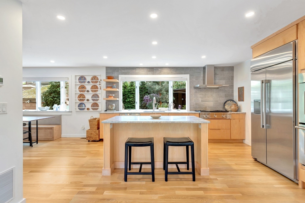 40 Holland Road Melrose, MA 02176 - Photo 9 of 42 a kitchen with granite countertop a stove and a refrigerator