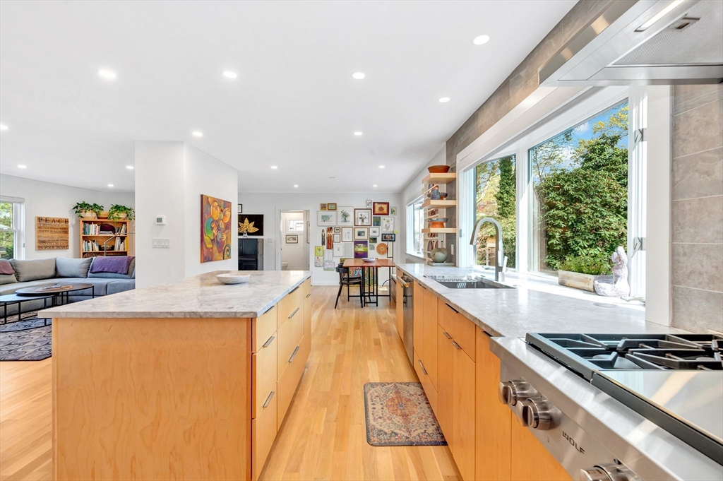 40 Holland Road Melrose, MA 02176 - Photo 10 of 42 a large kitchen with stainless steel appliances lots of counter top space