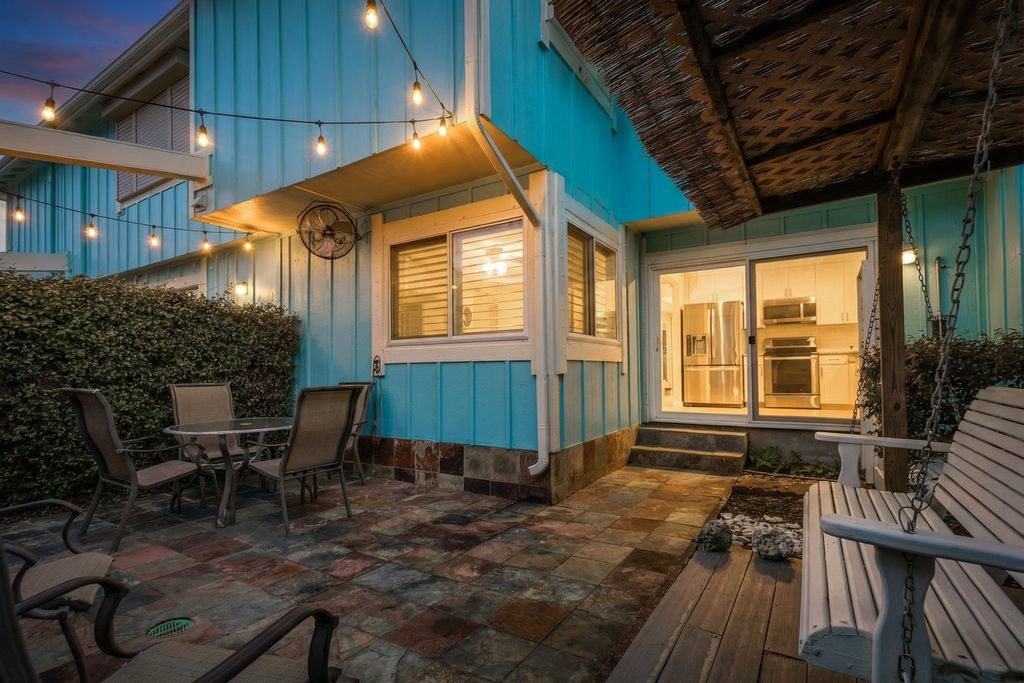 7516 Stewart Road Galveston, TX 77551 - Photo 13 of 25 a view of a house with backyard sitting area and furniture
