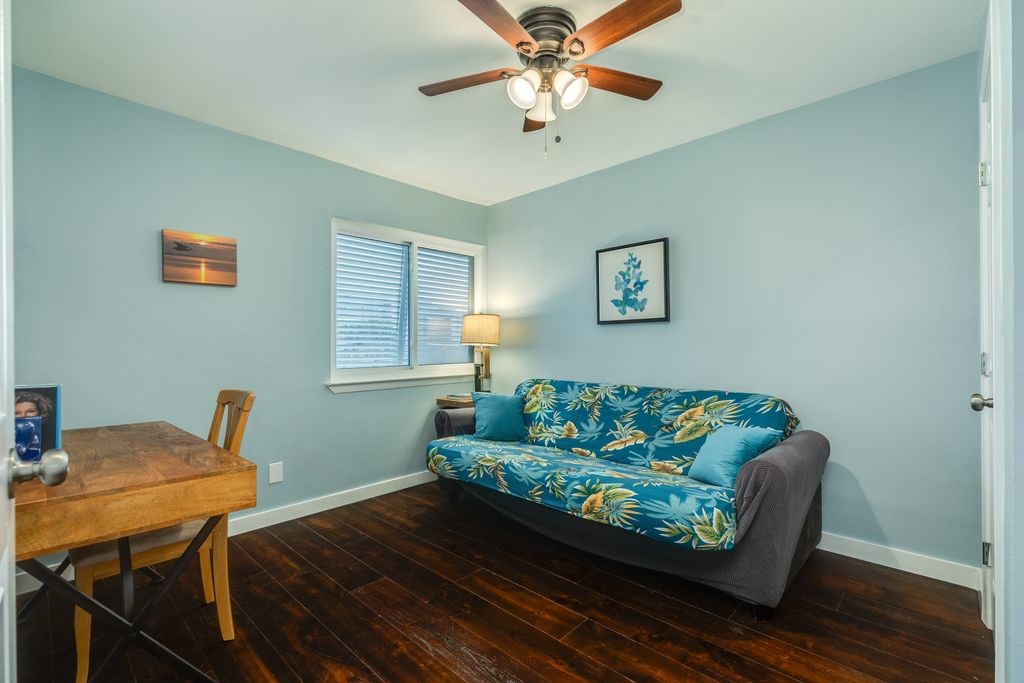7516 Stewart Road Galveston, TX 77551 - Photo 17 of 25 a living room with furniture and a wooden floor