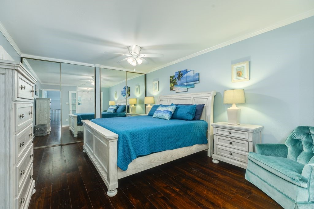 7516 Stewart Road Galveston, TX 77551 - Photo 20 of 25 a bedroom with a bed and a furniture