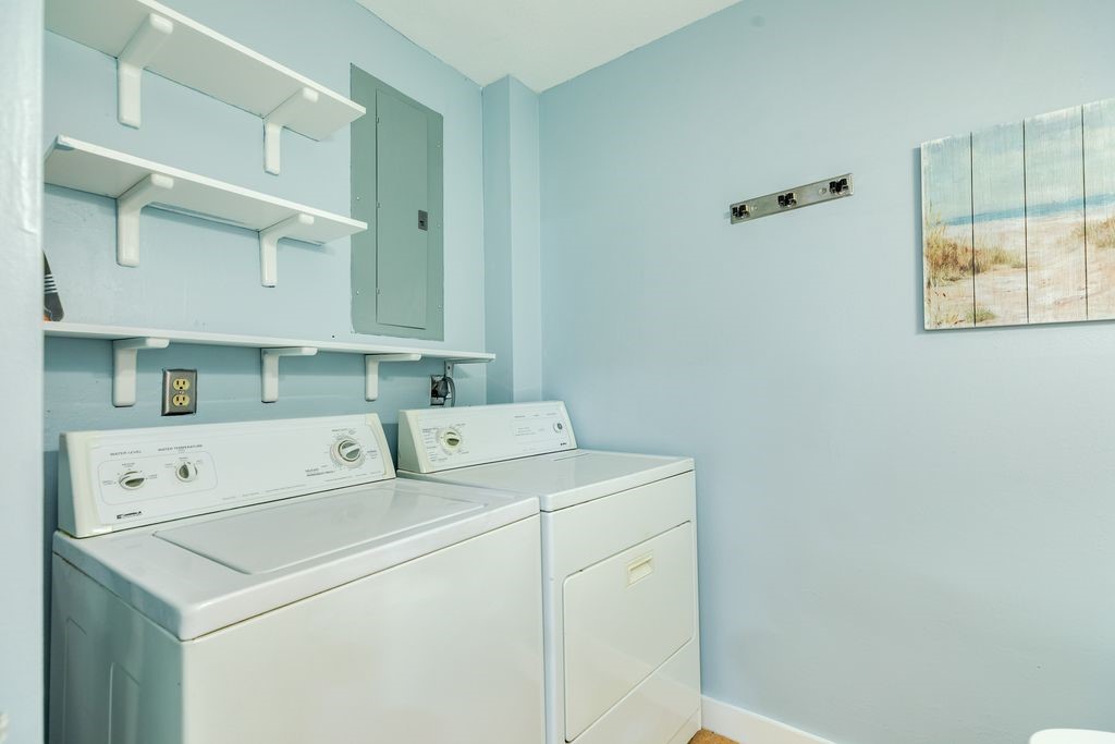 7516 Stewart Road Galveston, TX 77551 - Photo 23 of 25 a utility room with dryer and washer