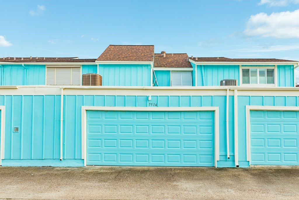 7516 Stewart Road Galveston, TX 77551 - Photo 25 of 25 a front view of a house with a garage