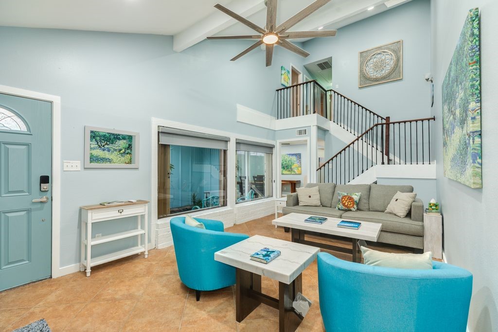 7516 Stewart Road Galveston, TX 77551 - Photo 3 of 25 a living room with furniture and a wooden floor