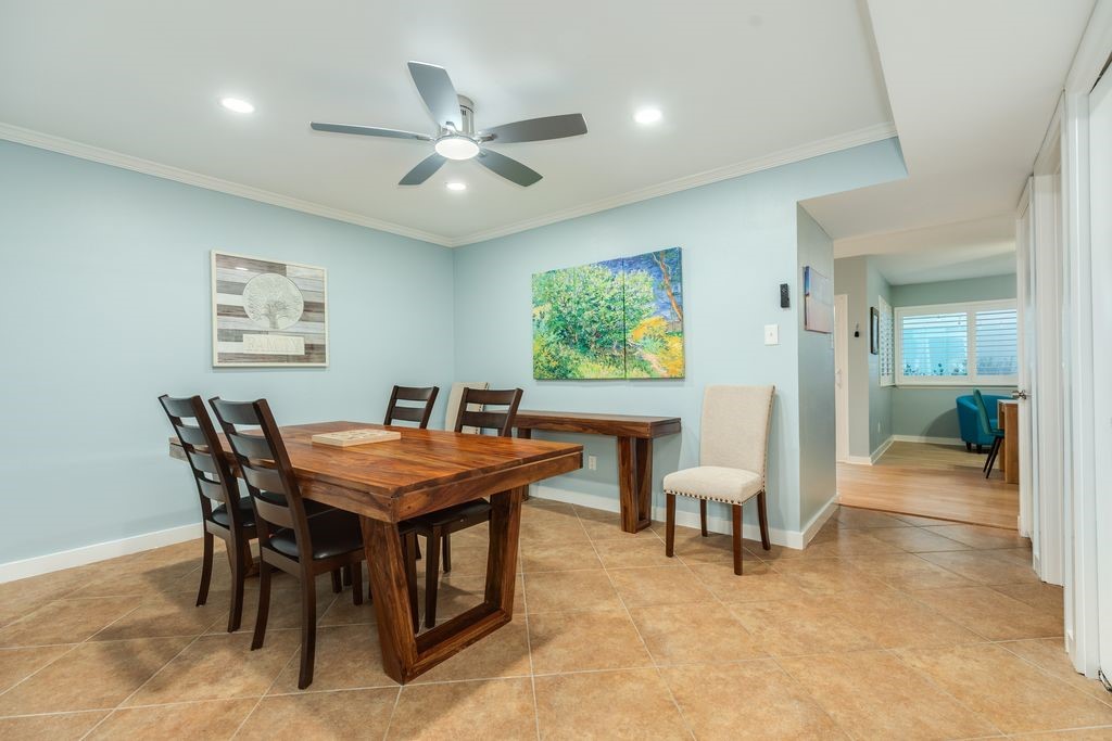 7516 Stewart Road Galveston, TX 77551 - Photo 5 of 25 a dining room with furniture and window