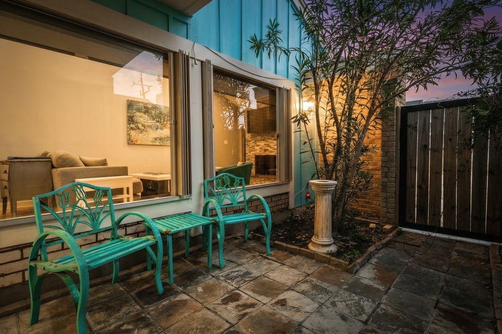7516 Stewart Road Galveston, TX 77551 - Photo 8 of 25 a view of a patio with table and chairs and potted plants