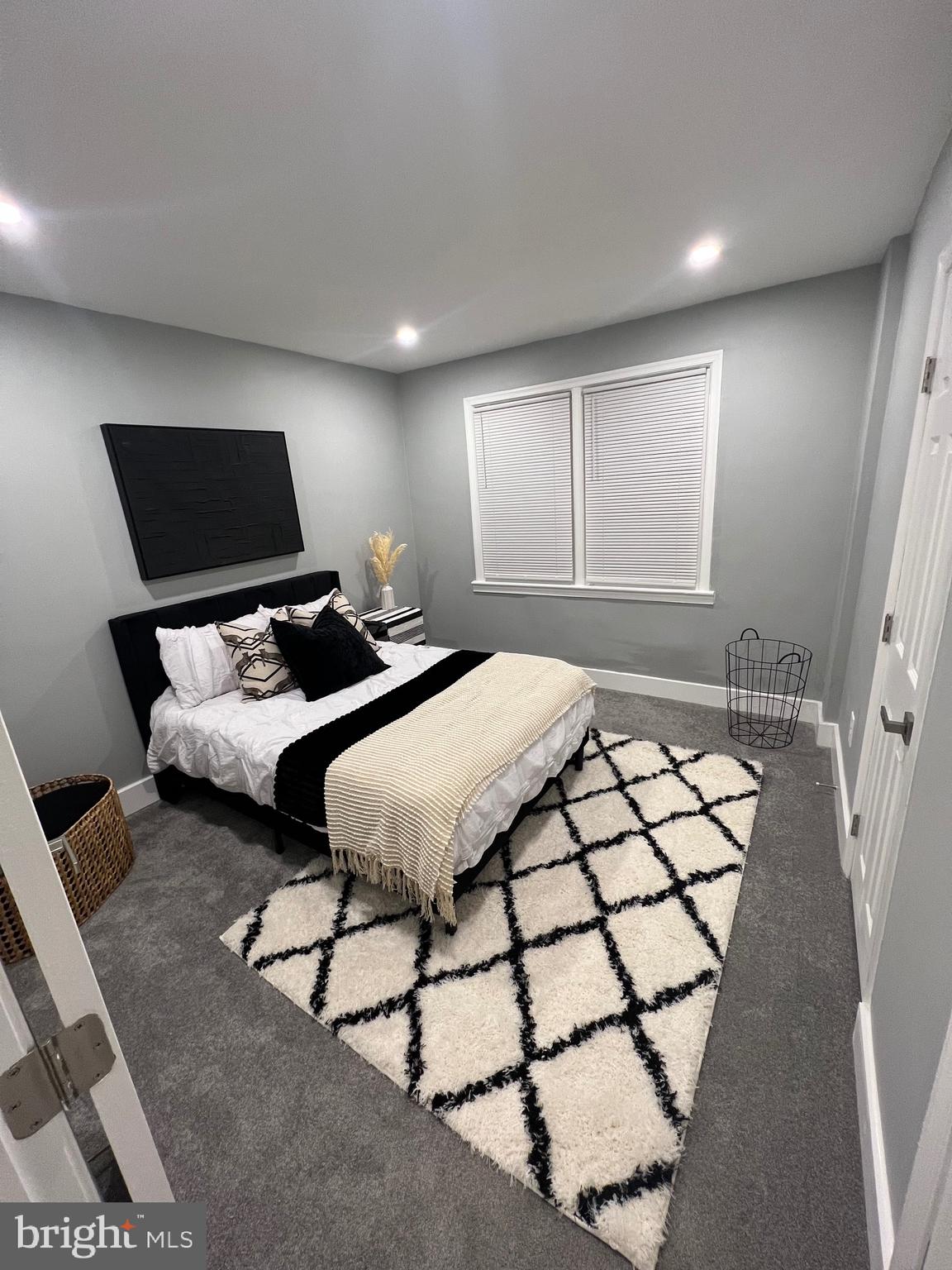 517 7th Street Northeast, Unit 2 Washington, DC 20002 - Photo 11 of 17 a bedroom with furniture and a bed