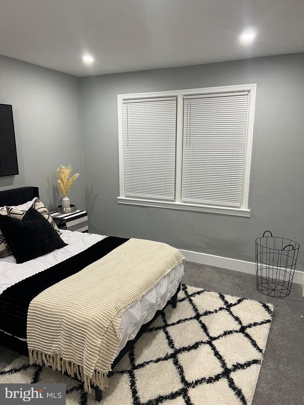 517 7th Street Northeast, Unit 2 Washington, DC 20002 - Photo 12 of 17 a bedroom with a bed and a window