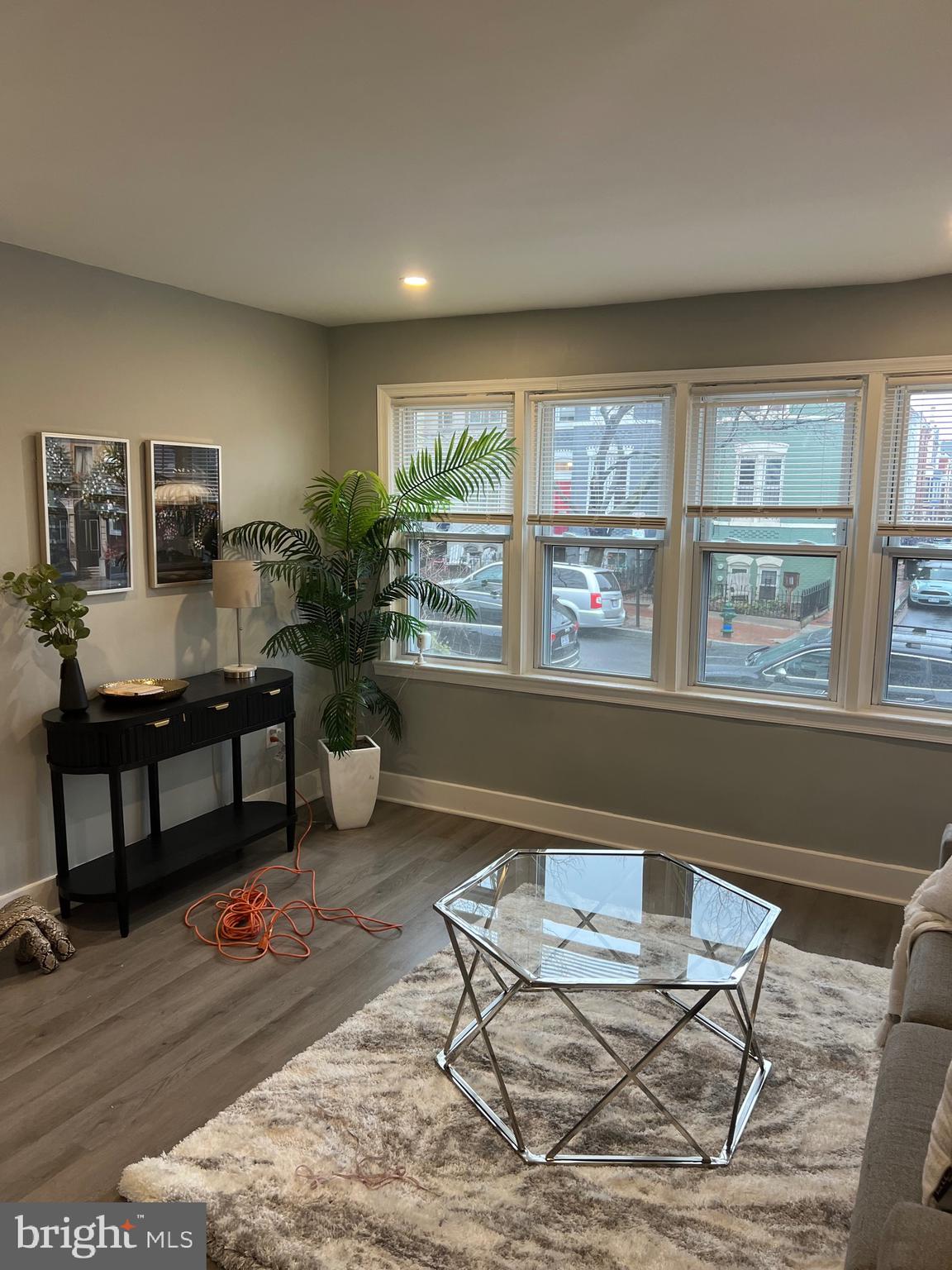 517 7th Street Northeast, Unit 2 Washington, DC 20002 - Photo 14 of 17 a living room with furniture and a window