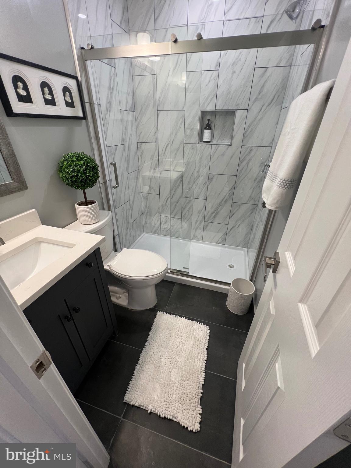 517 7th Street Northeast, Unit 2 Washington, DC 20002 - Photo 16 of 17 a bathroom with a sink and a mirror