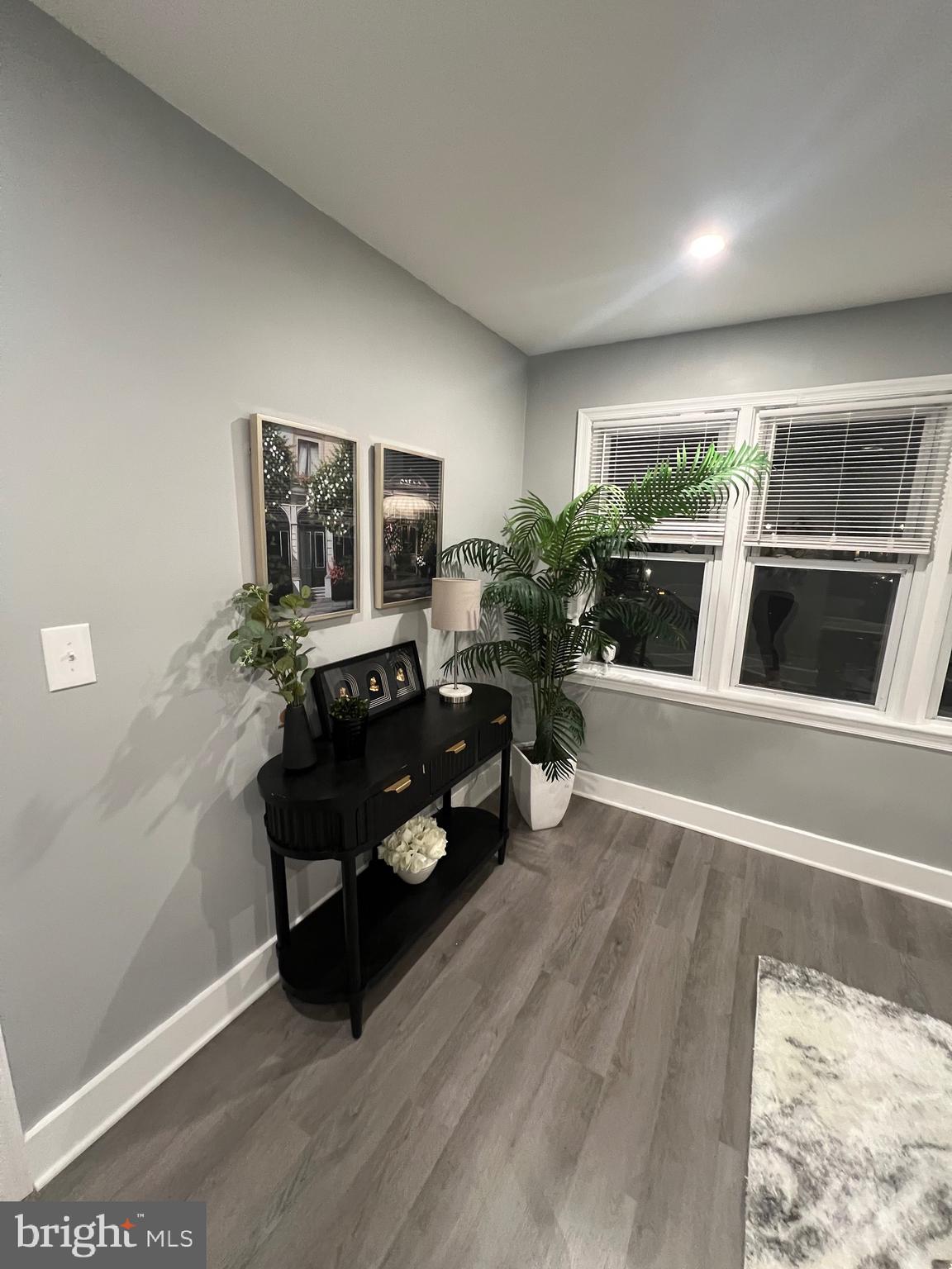 517 7th Street Northeast, Unit 2 Washington, DC 20002 - Photo 6 of 17 a living room with furniture and wooden floor