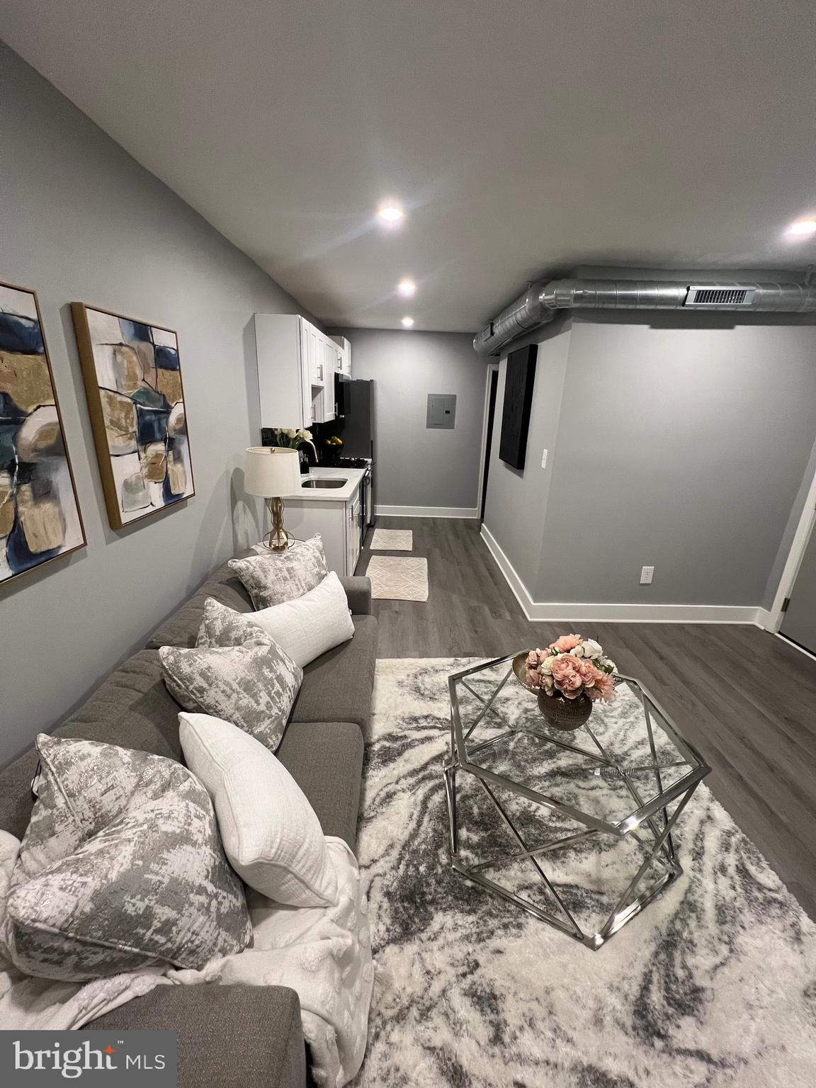 517 7th Street Northeast, Unit 2 Washington, DC 20002 - Photo 7 of 17 a living room with furniture and a wooden floor