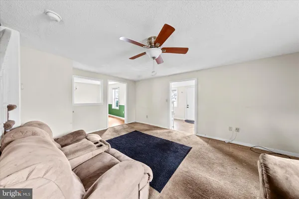 a living room with furniture and a rug