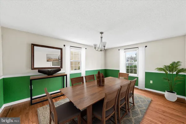 a view of a kitchen with a sink dishwasher and a refrigerator
