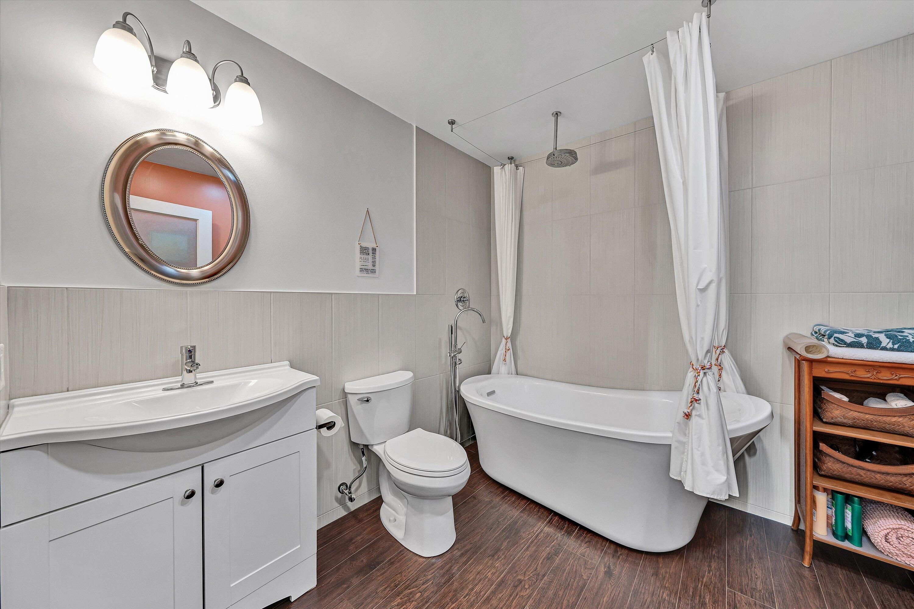 1124 Old Hollow Road Buchanan, VA 24066 - Photo 54 of 73 a bathroom with a toilet a sink and a bathtub