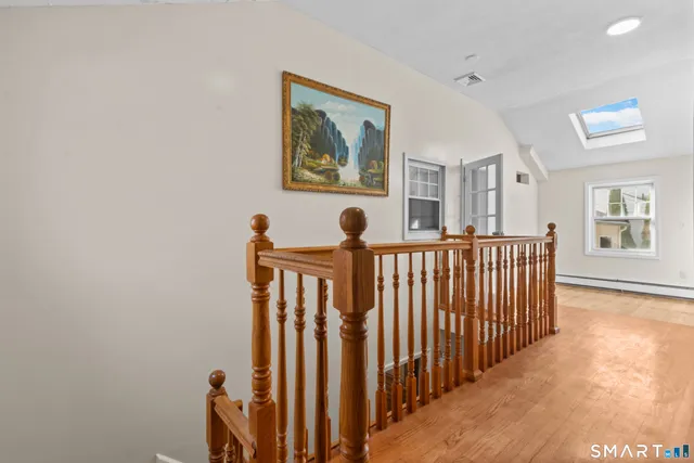 a view of a hallway with windows