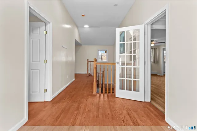 a view of entryway with wooden floor