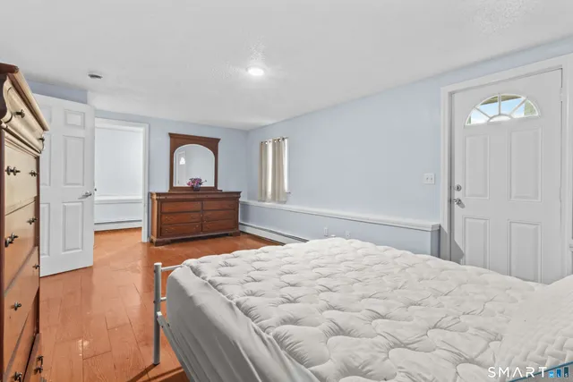 a bedroom with a bed and a dresser