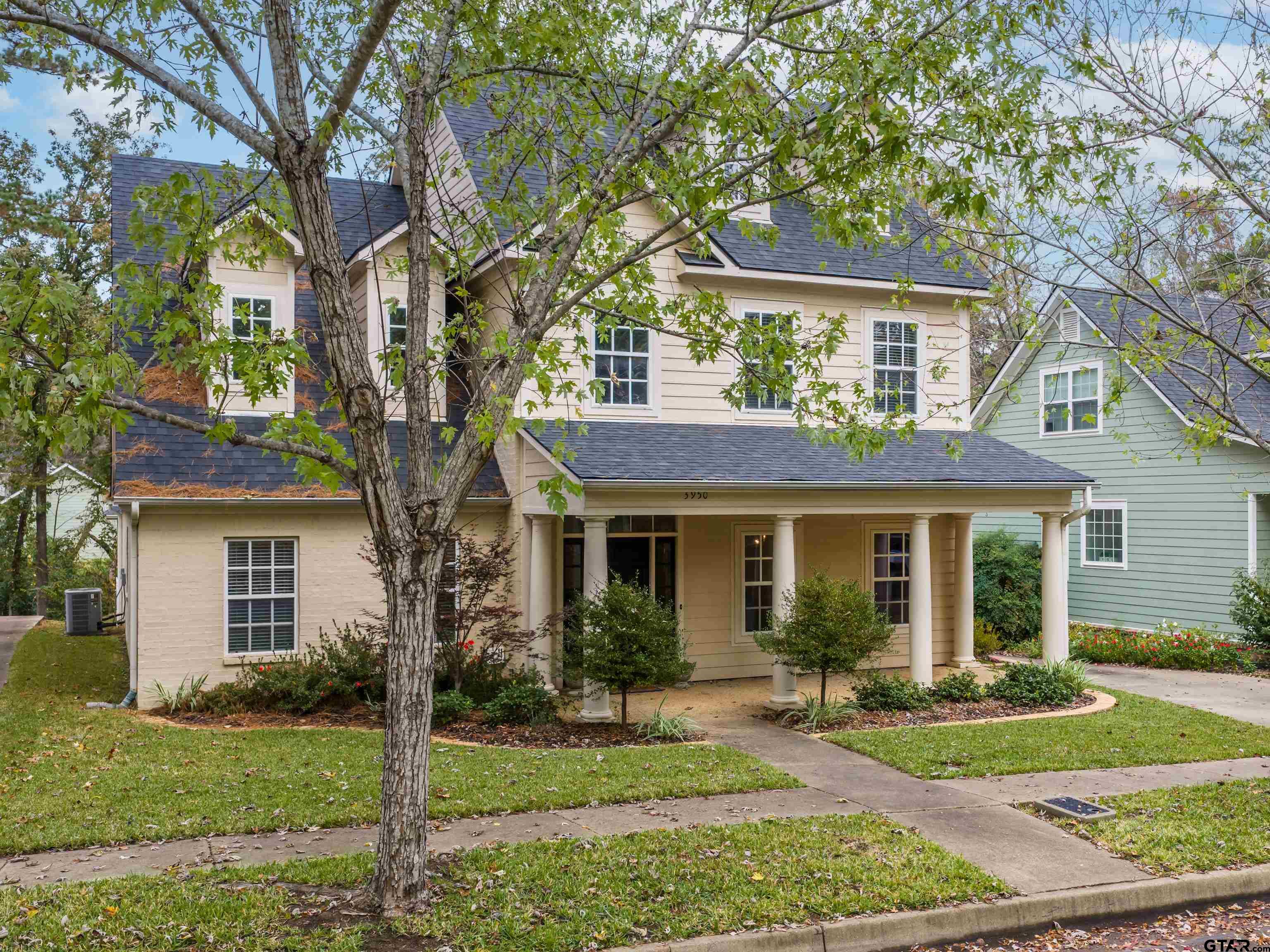 3950 Hanover Place Tyler, TX 75701 - Photo 2 of 44 a front view of a house with garden
