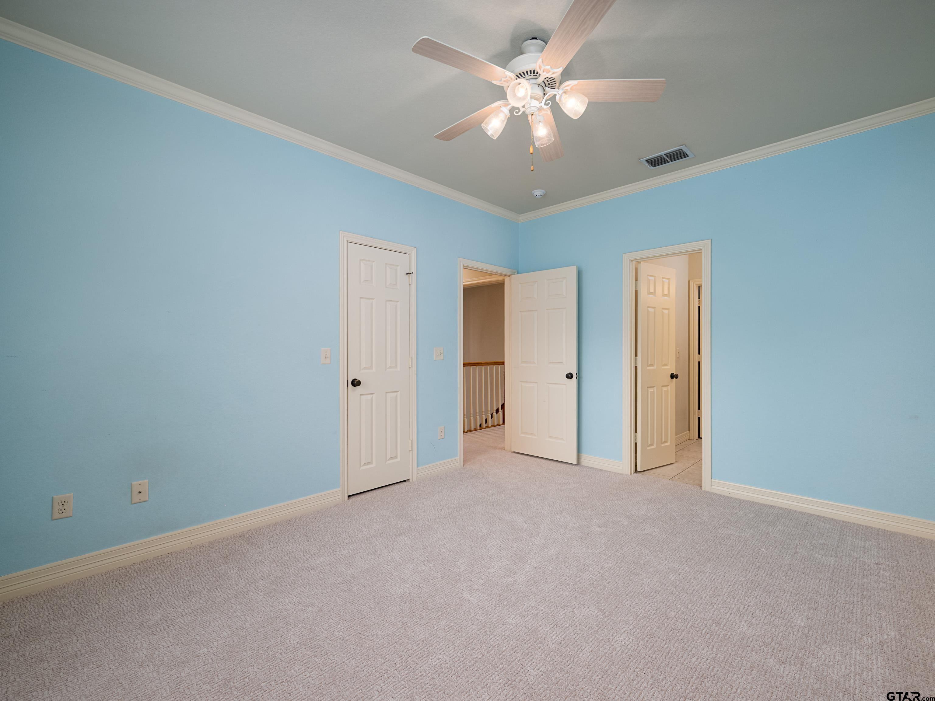 3950 Hanover Place Tyler, TX 75701 - Photo 27 of 44 an empty room with a ceiling fan and a window