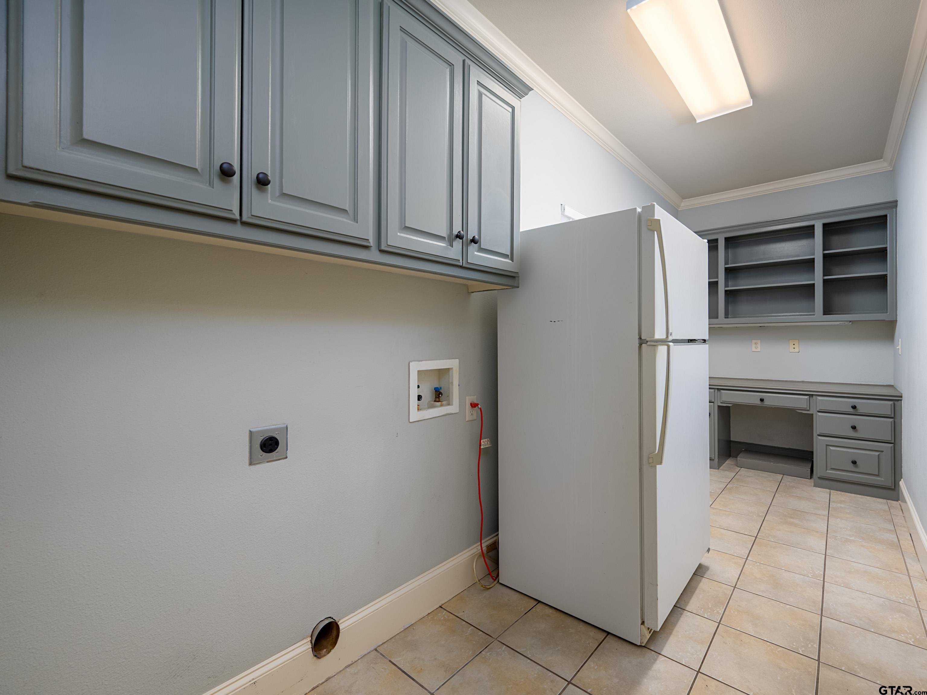 3950 Hanover Place Tyler, TX 75701 - Photo 32 of 44 a kitchen with stainless steel appliances a refrigerator and cabinets