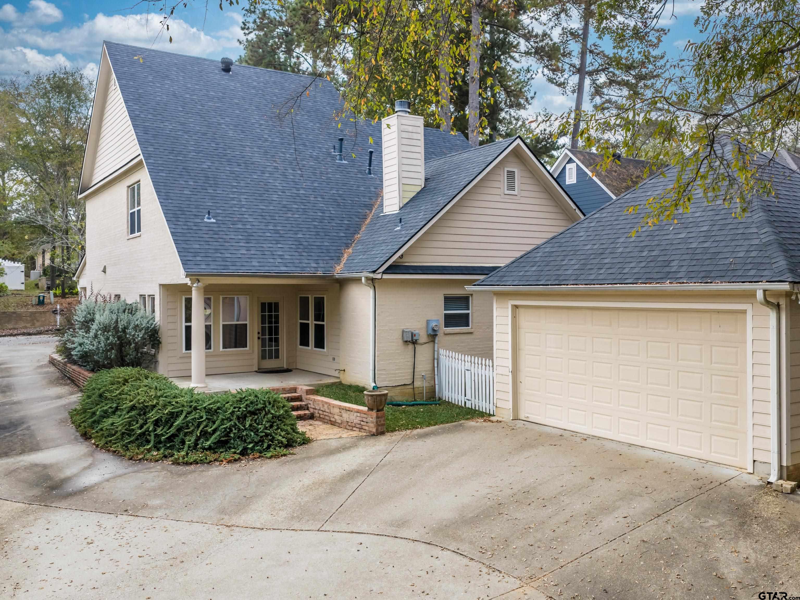 3950 Hanover Place Tyler, TX 75701 - Photo 33 of 44 a view of a house with a yard and large tree