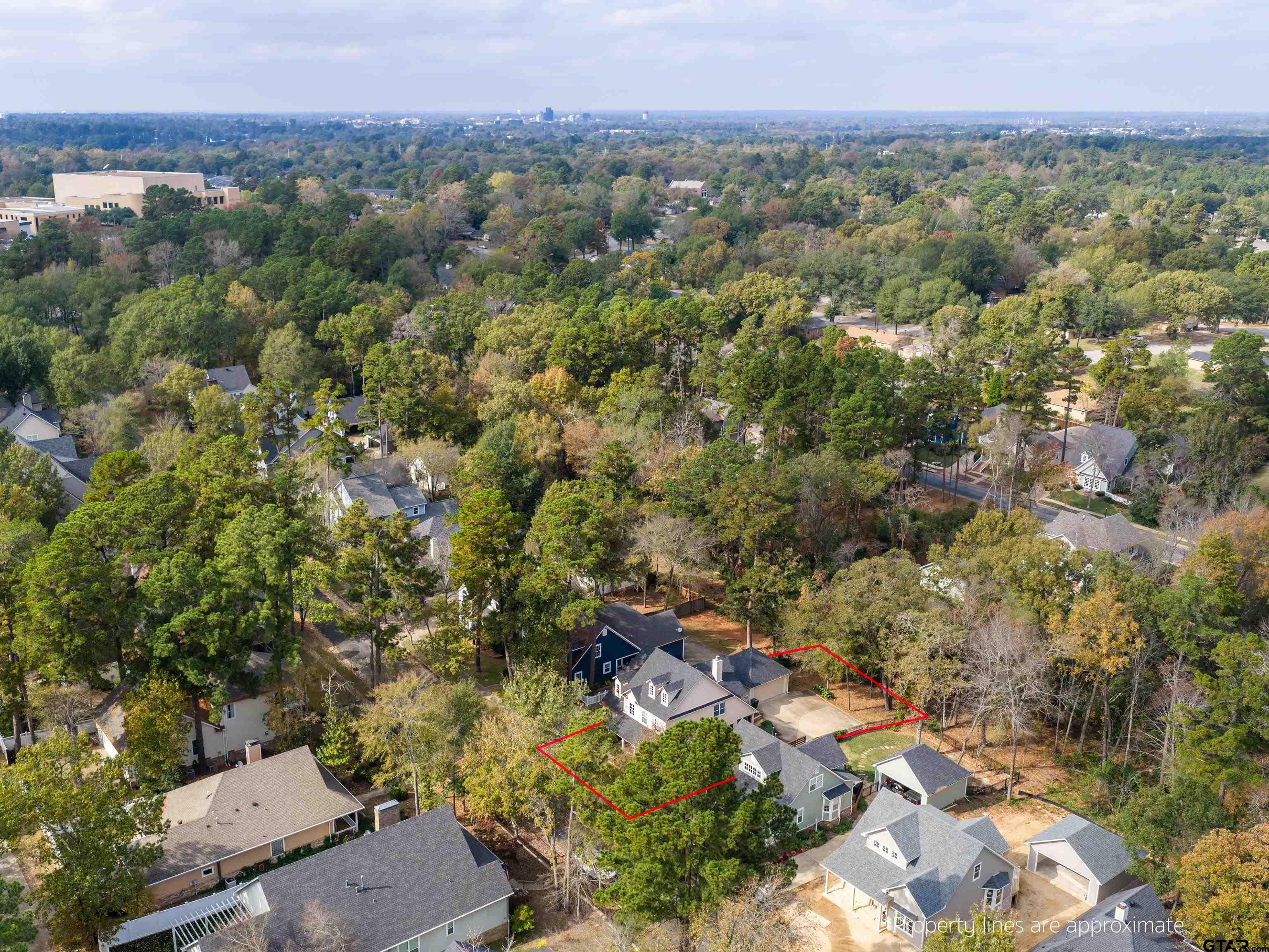 3950 Hanover Place Tyler, TX 75701 - Photo 43 of 44 an aerial view of a houses with a yard and mountain view in back