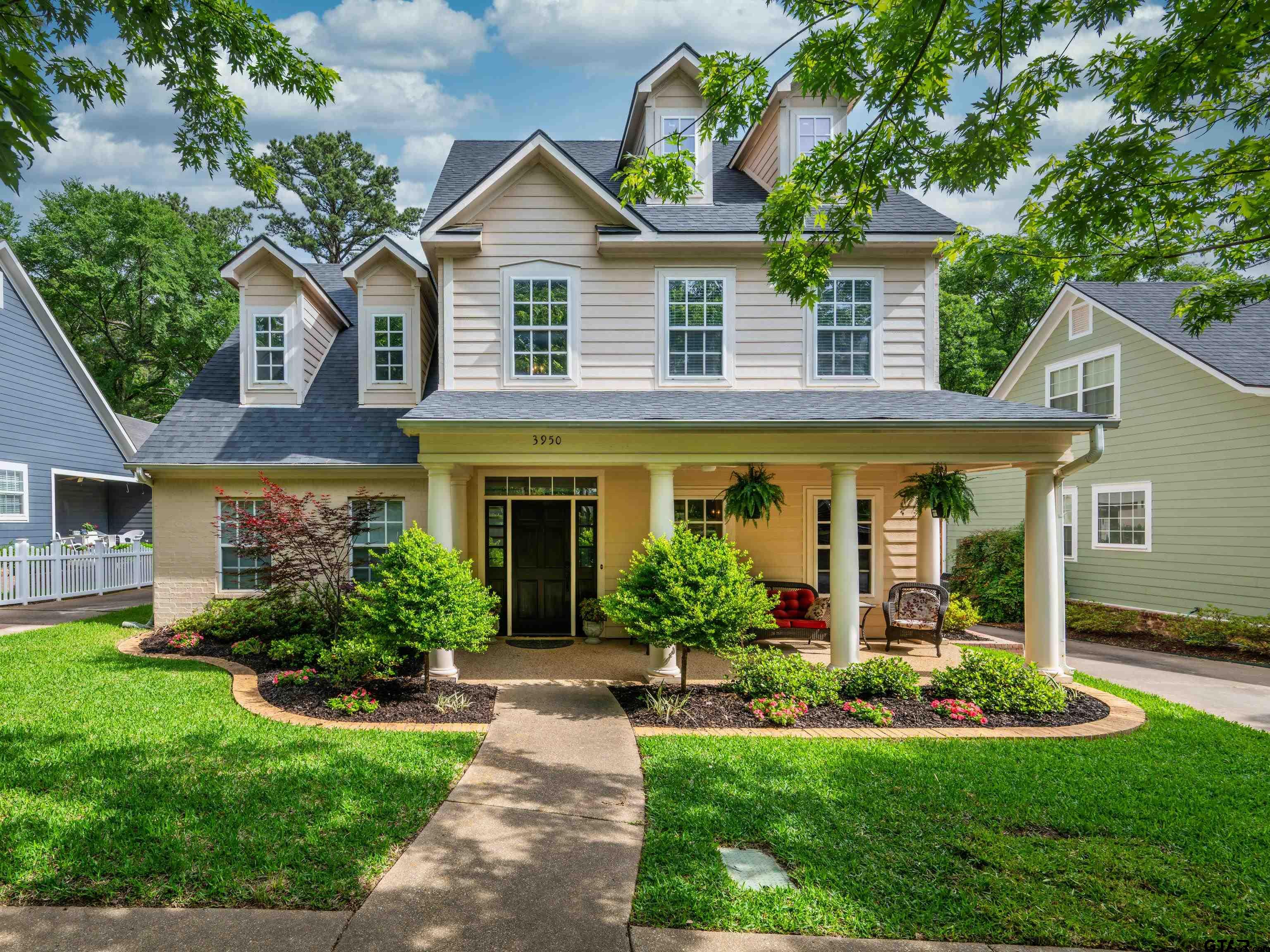 3950 Hanover Place Tyler, TX 75701 - Photo 44 of 44 a front view of a house with a yard and potted plants
