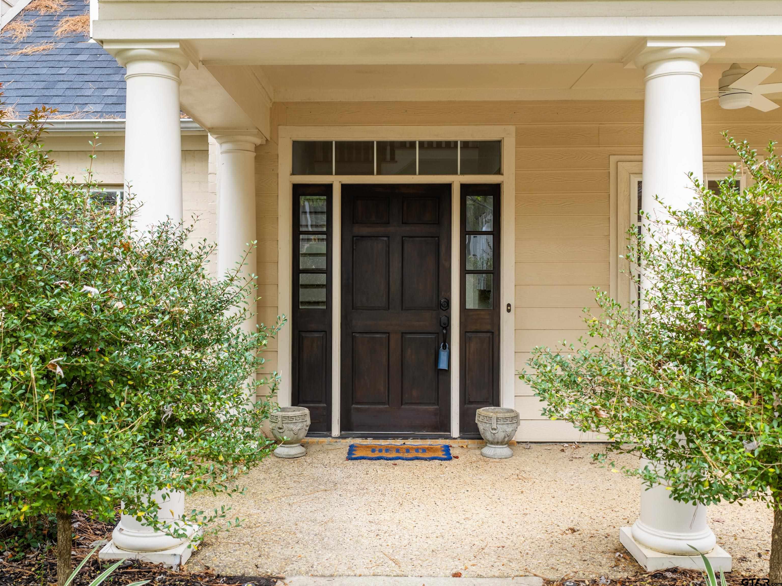 3950 Hanover Place Tyler, TX 75701 - Photo 5 of 44 a front view of a house with a yard and garage