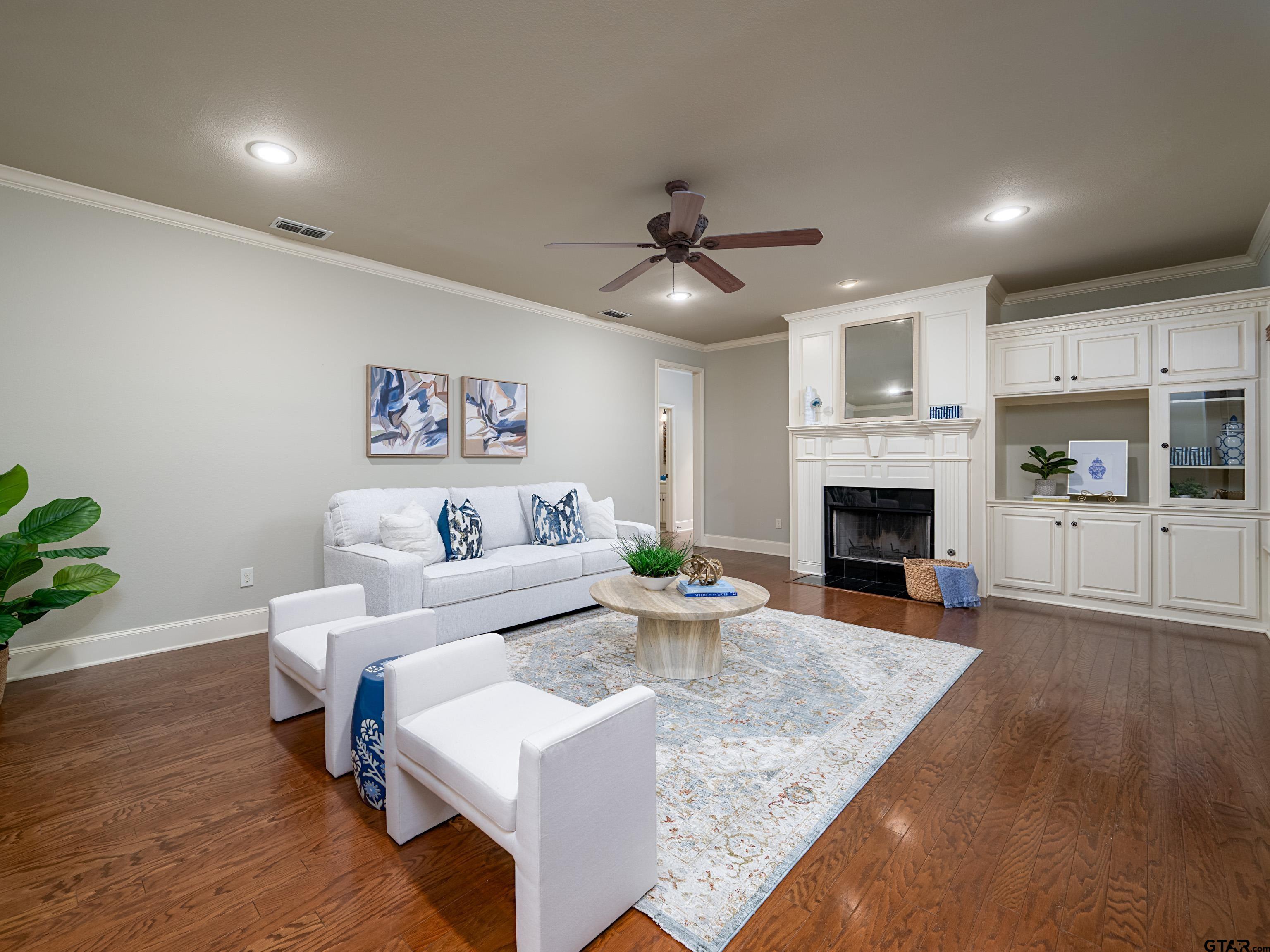 3950 Hanover Place Tyler, TX 75701 - Photo 8 of 44 a living room with furniture and a fireplace