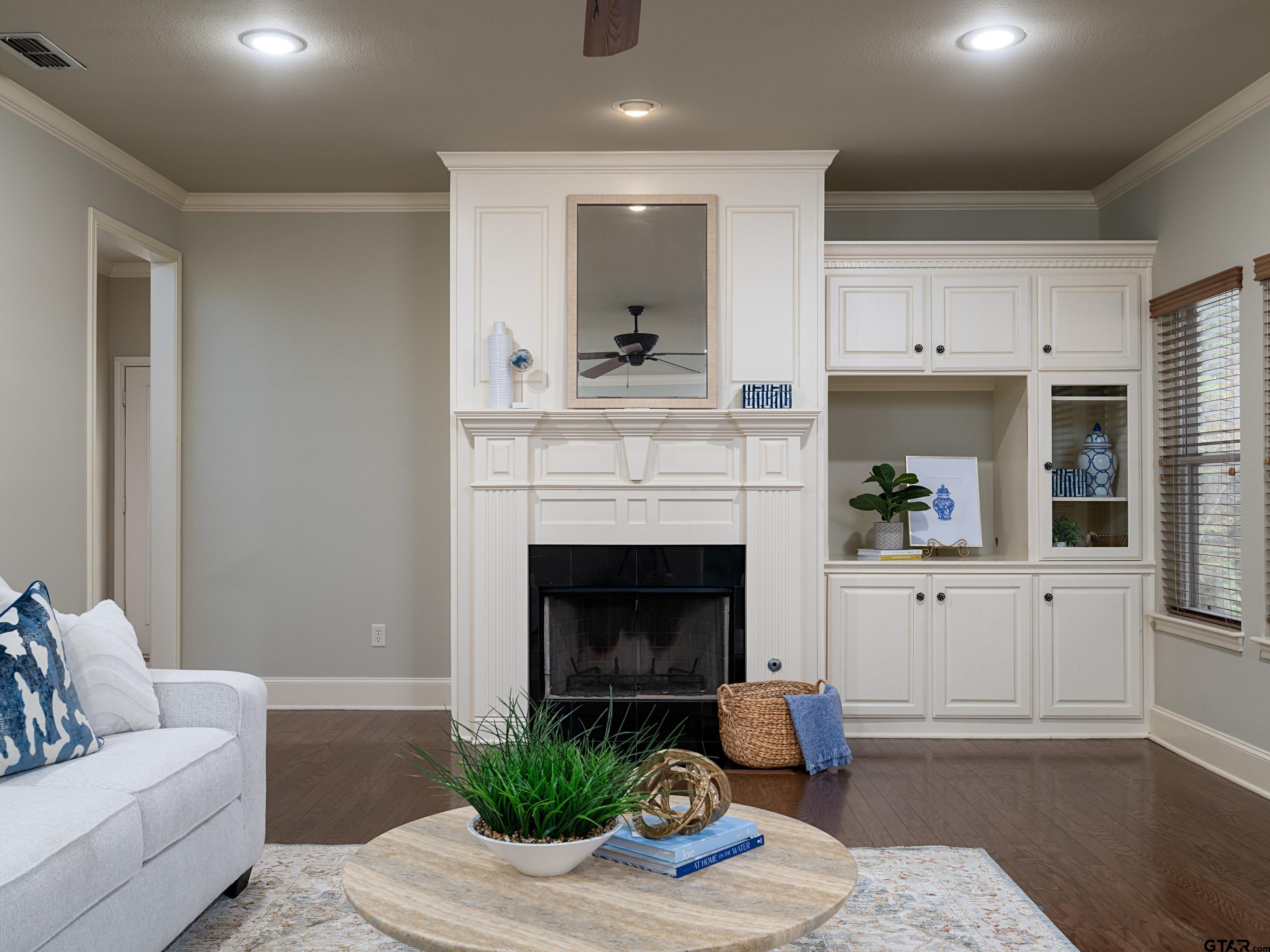 3950 Hanover Place Tyler, TX 75701 - Photo 9 of 44 a living room with furniture and a fireplace