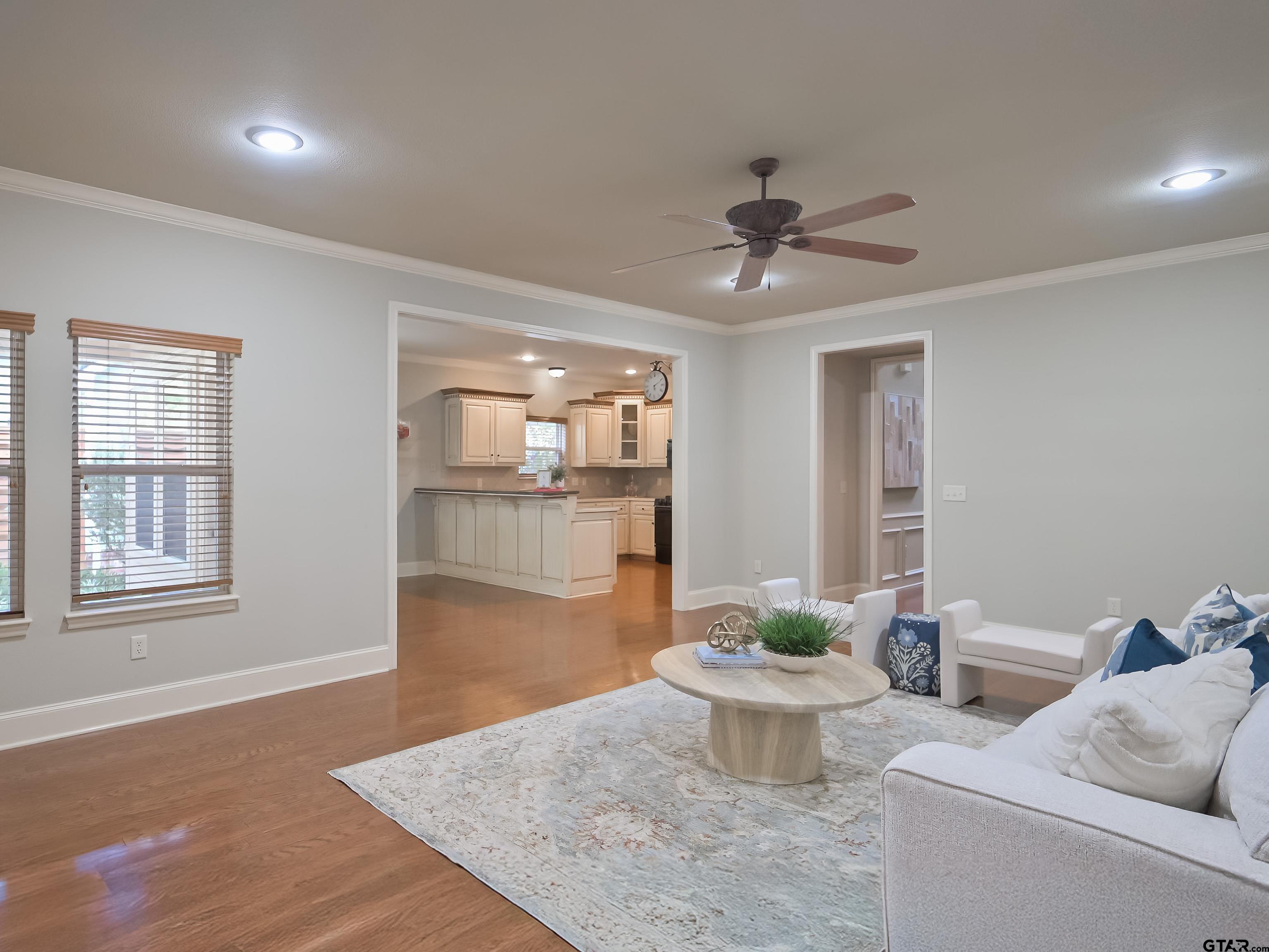 3950 Hanover Place Tyler, TX 75701 - Photo 10 of 44 a living room with furniture and a wooden floor