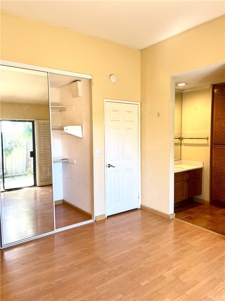 48 Riverstone, Unit 60 Irvine, CA 92606 - Photo 14 of 31 a view of an empty room with closet and a window