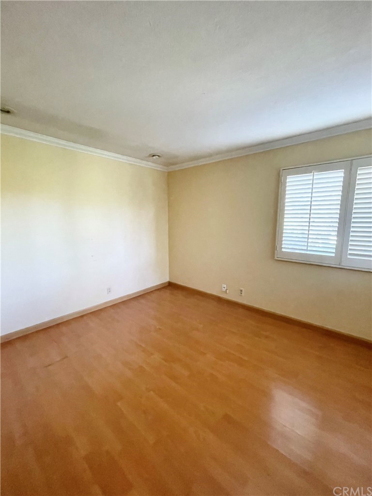 48 Riverstone, Unit 60 Irvine, CA 92606 - Photo 15 of 31 an empty room with a windows and closet