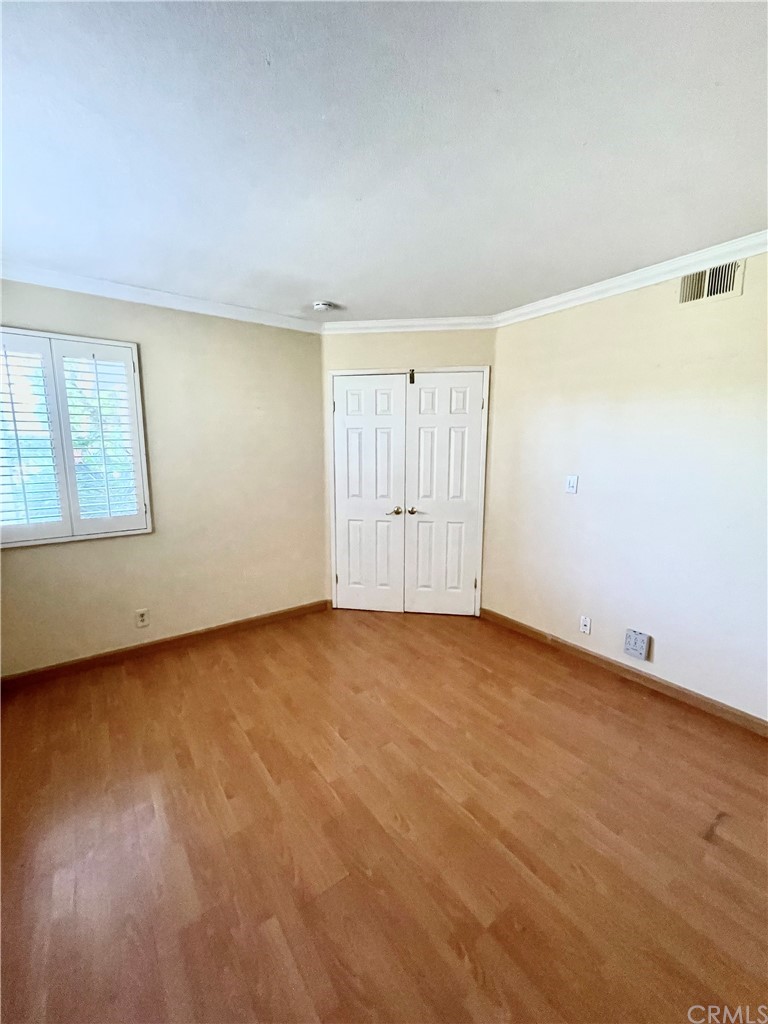 48 Riverstone, Unit 60 Irvine, CA 92606 - Photo 16 of 31 an empty room with a empty space and windows