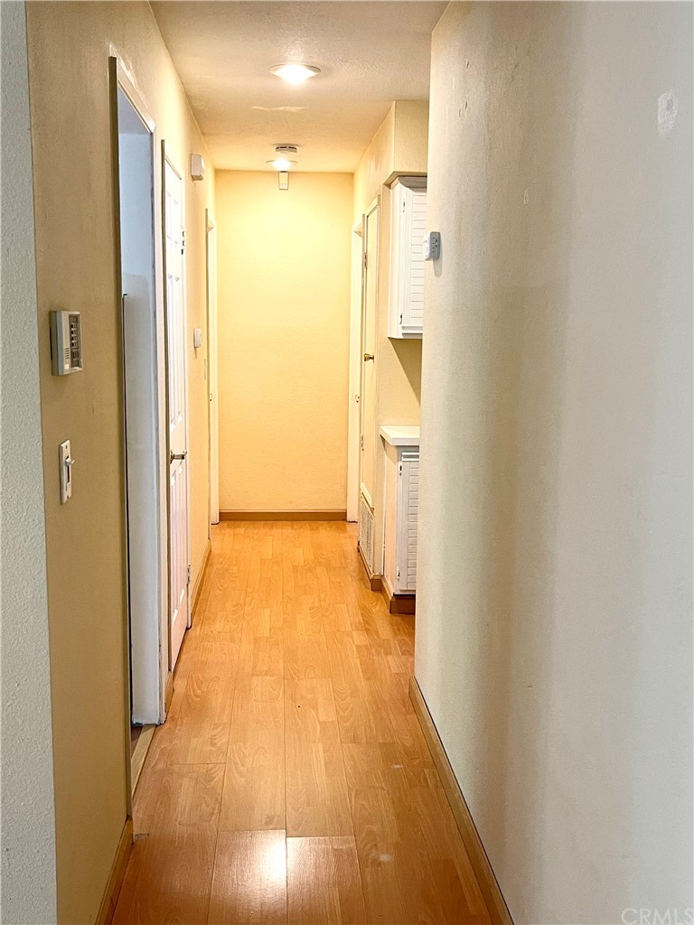 48 Riverstone, Unit 60 Irvine, CA 92606 - Photo 19 of 31 a view of a bathroom with a hallway