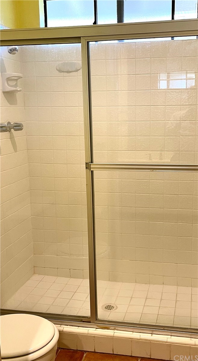 48 Riverstone, Unit 60 Irvine, CA 92606 - Photo 20 of 31 a bathroom with a shower and a toilet