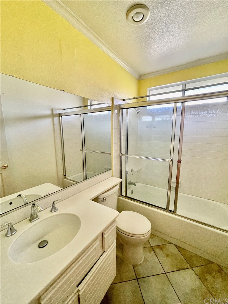 48 Riverstone, Unit 60 Irvine, CA 92606 - Photo 21 of 31 a bathroom with a sink toilet and shower