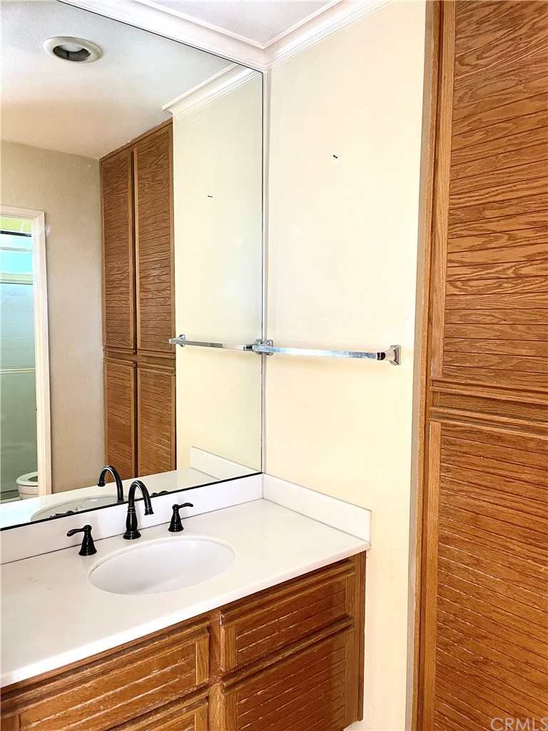 48 Riverstone, Unit 60 Irvine, CA 92606 - Photo 22 of 31 a bathroom with a sink and a mirror