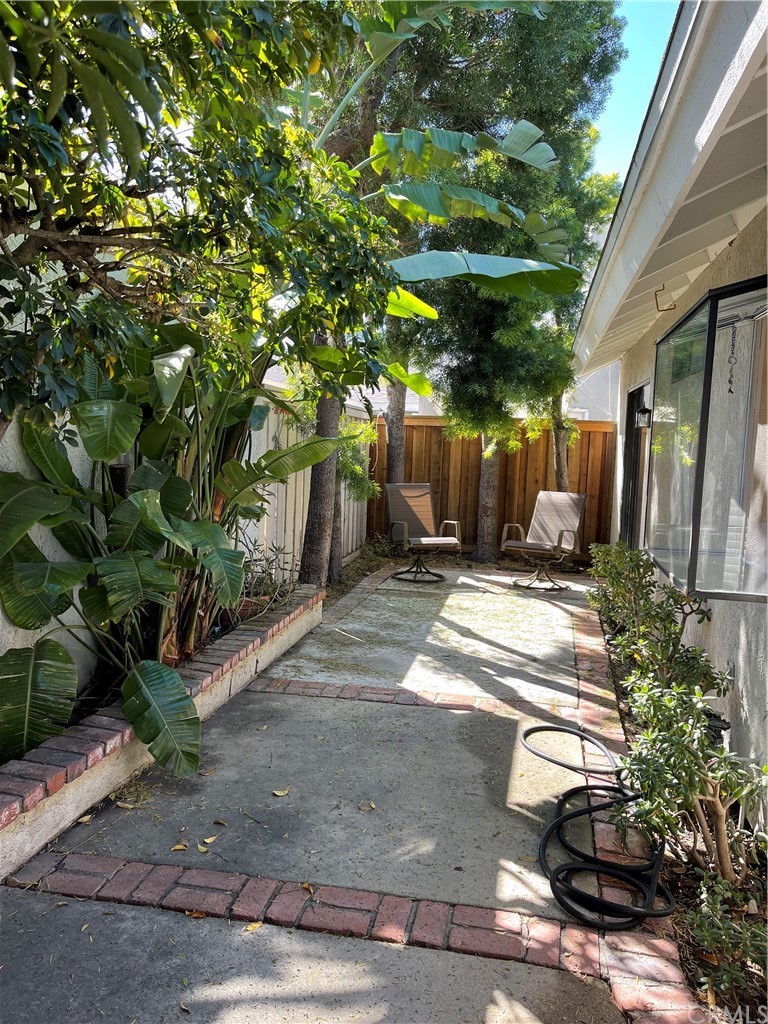48 Riverstone, Unit 60 Irvine, CA 92606 - Photo 23 of 31 a view of a yard with plants and large trees