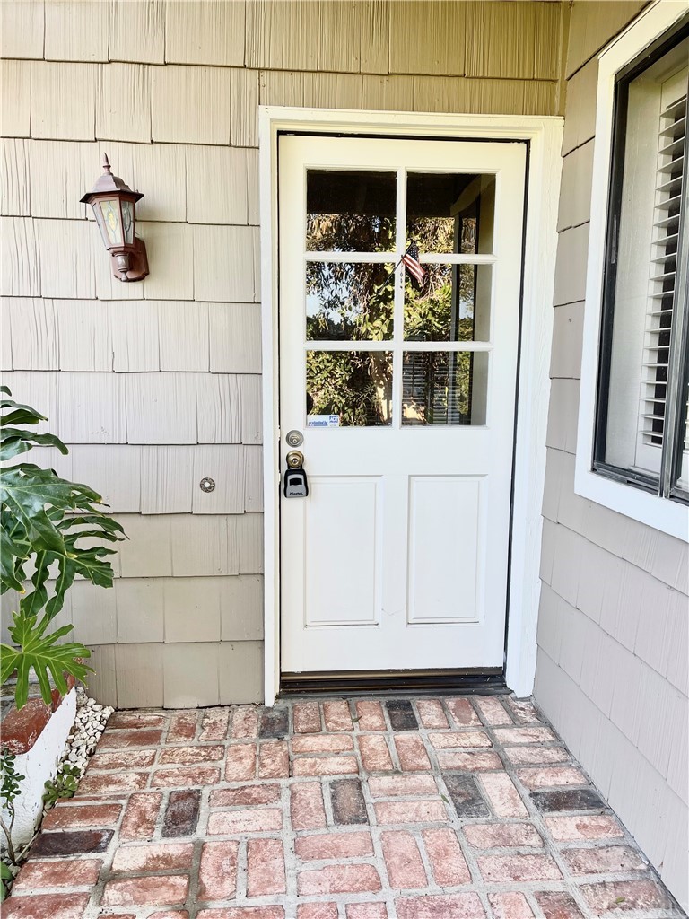 48 Riverstone, Unit 60 Irvine, CA 92606 - Photo 4 of 31 a view of a wooden door