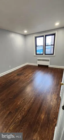 a room with a washing machine and a rug